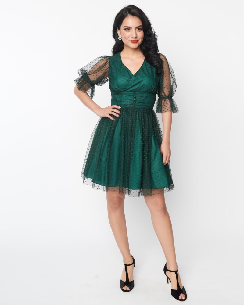 Front of a model wearing a size L Unique Vintage Emerald Clip Dot Shirred Babydoll Dress in Green/Clipdot by Unique Vintage. | dia_product_style_image_id:315016